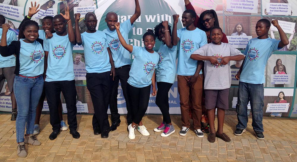 A group of young people in Malawi celebrating the ban on child marriage