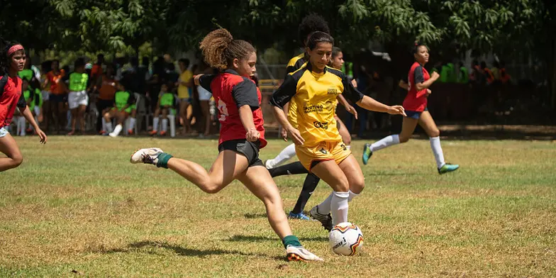 Girls playing football
