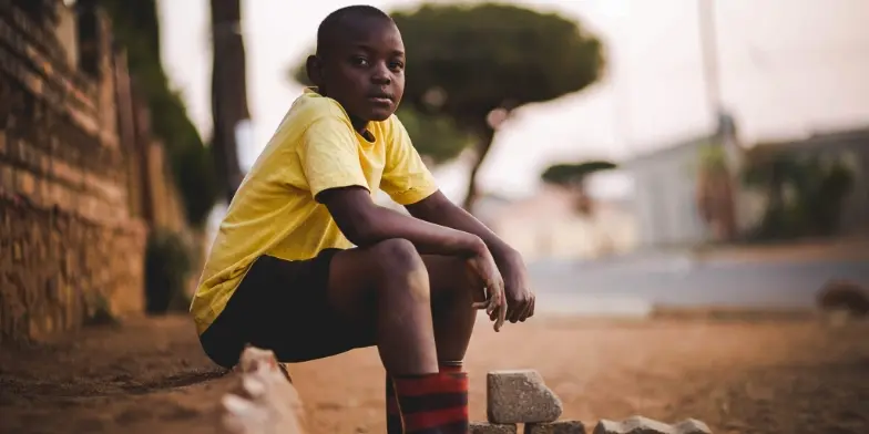 Boy sat on step
