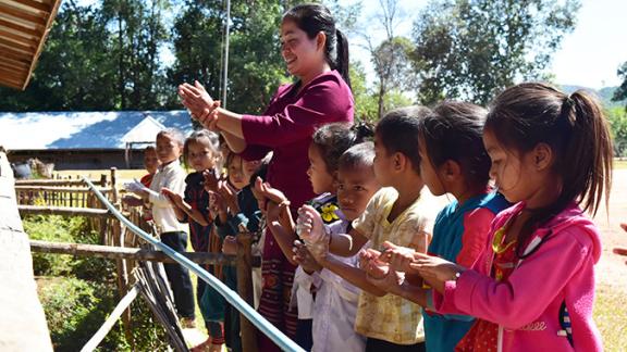 Children learn handwashing in Laos. Our emergency response to coronavirus includes sharing public health information and implementing effective hygiene practices, including the installation of additional hand-washing facilities.