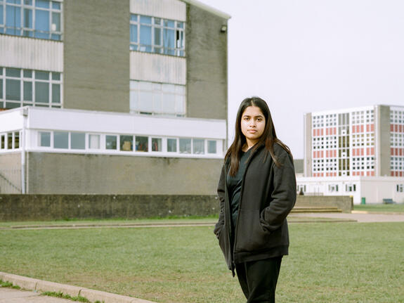 Jaiza, 13, standing outside her school in Cardiff