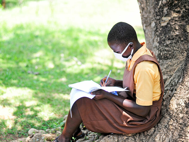 Girl takes part in COVID-19 awareness raising activity at school in Ghana