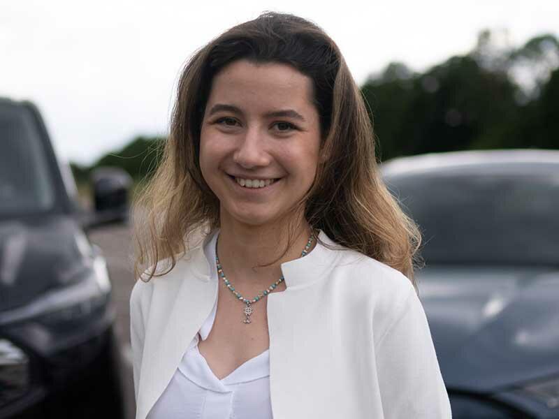 A girl smiles at the camera