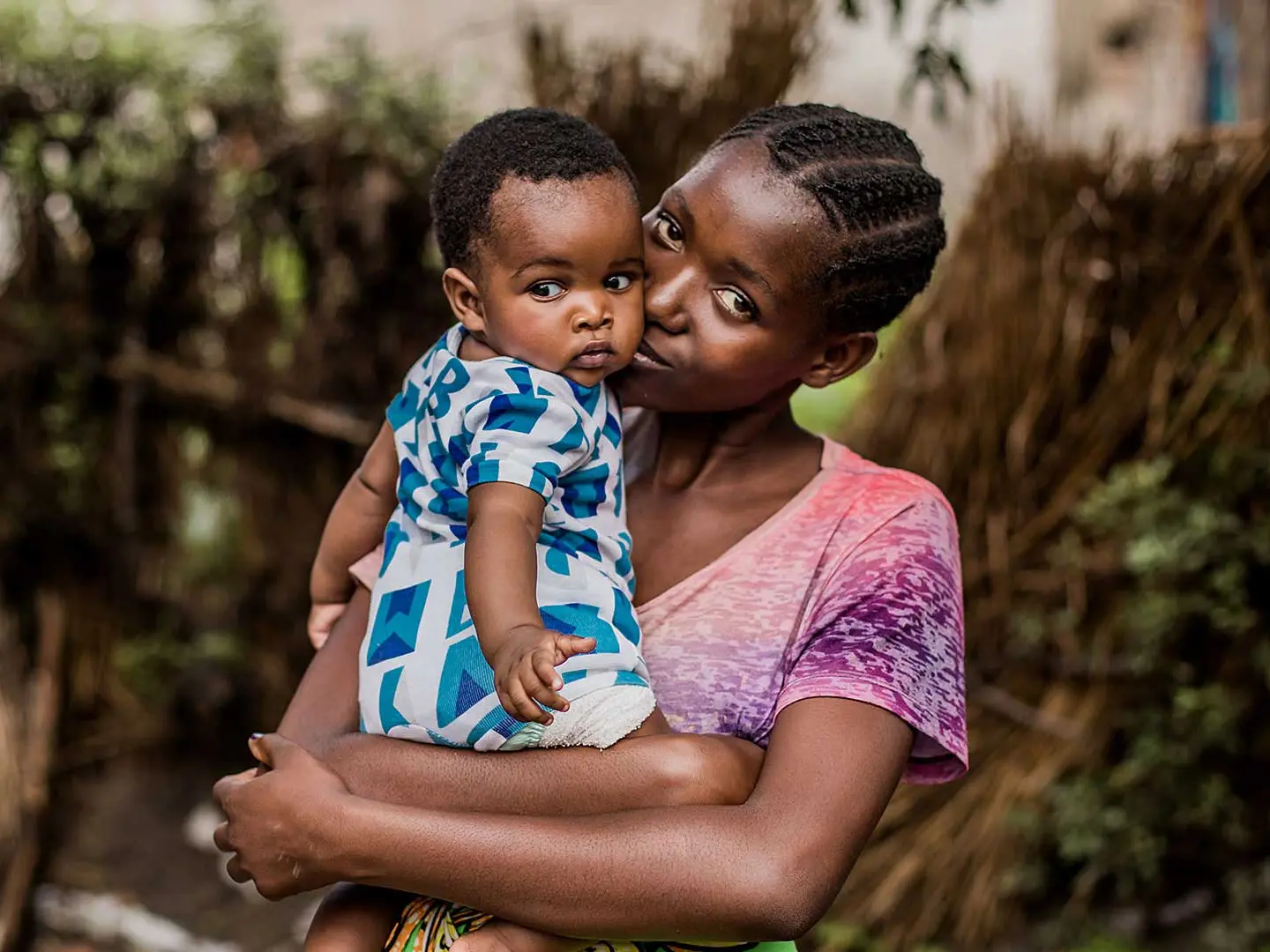 Melissa, 18, holding her baby in Zambia.